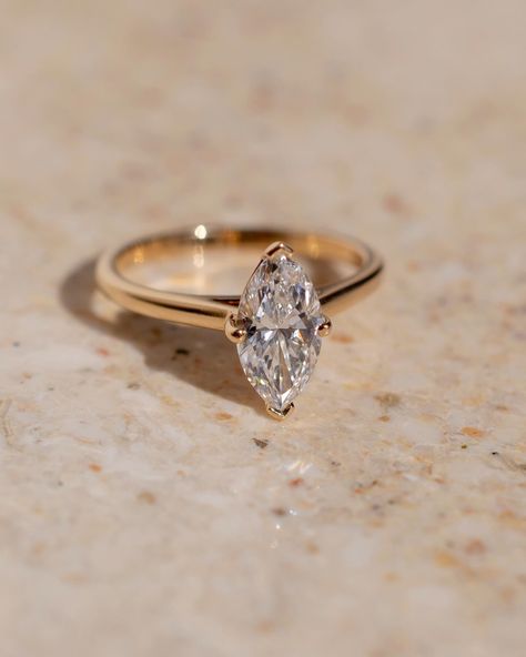 Fun fact - because of their cut, marquise tend to look bigger than their carat weight ✨ This gorgeous solitaire style features a lifted cathedral setting to allow for a straight wedding band to sit flush. Details: - 1.28ct marquise diamond - 14k yellow gold - 1.8mm wide shank #marquiseengagementring #nz #labgrowndiamond #customengagementring #aus Marquise Diamond Ring 1 Carat, Gold Marquee Engagement Ring, Marquise Cut Wedding Rings, Yellow Gold Anniversary Rings, Engagement Ring Classic, Marquise Cut Rings, Anniversary Rings For Her, Marquise Diamond Ring, Ring Proposal