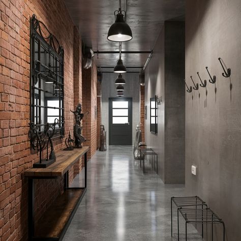 Industrial chic interiors with a cozy twist! What do you think of exposed brick walls? 🏙️💖 #interiordesign #industrialdesign #design #industrialstyle Exposed Brick Salon Spaces, Warehouse Venue Industrial Chic, Cement And Brick Wall, Brick Industrial Interior, Lobby Industrial Design, Industrial Library Design, Concrete Wall Interior Design, Industrial Foyer, Bagged Brick