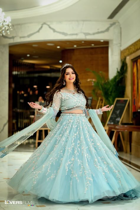 Powder blue lehenga with minimal jewellery and a sparkling tiara.  For more such beautiful outfit, Book your wedding Designers on ShaadiSaga.com   | Shaadisaga | Bridal Lehenga | Bridal Makeup | Mehendi | Bridal Jewellery | Tiara | Chooda | Bridal Portrait | Royal Look Blue Lehenga Jewellery Ideas, Lehenga Jewellery Ideas, Minimalistic Bride, Sky Blue Lehenga, Mehendi Bridal, Lehenga Jewellery, Wedding Designers, Latest Bridal Lehenga, Lehenga Bridal