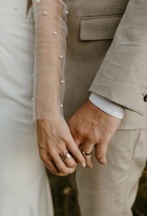 Close up of wedding couples hands with wedding rings on in mitchells meadows Wedding Photo Ring, Hand Holding Wedding Photo, Wedding Photos Rings Hands, Wedding Ring Shots Creative, Wedding Band Pictures, Holding Hands Wedding Rings, Bride And Groom Close Up, Up Close Wedding Photos, Holding Hands Wedding Photo