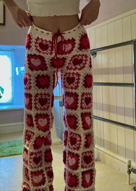 my homemade love heart granny square trousers. CURRENTLY BEING SOLD ON ETSY. HookedByAlice Heart Granny Square, Regnul Animal, Crochet Bottoms, Hippie Baby, Crochet Pants, Mode Crochet, Crochet Clothing And Accessories, Pola Sulam, Crochet Fashion Patterns