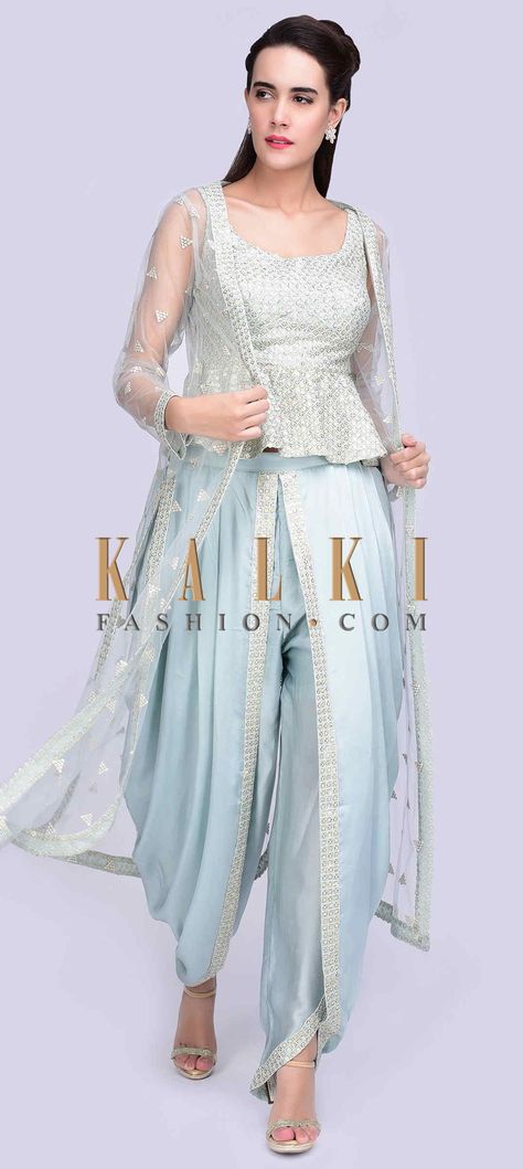 Buy Online from the link below. We ship worldwide (Free Shipping over US$100) Click Anywhere to Tag Ice blue embroidered peplum top with matching dhoti and long net jacket only on Kalki Ice blue georgette peplum top with thread and sequins jaal embroidery.It has a matching satin dhoti pant with an additional top layer with pleats.The set is teamed with a matching long net jacket with embroidered butti. Dhoti Pants Outfit Wedding, Latest Dhoti Style Dress, Dhoti Suits For Women, Dhoti Pants Outfit, Dhoti Style Dresses, Dhoti Salwar Suits, Net Jacket, Peplum Top Outfits, Jaal Embroidery