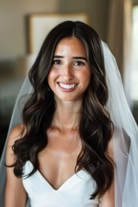 Explore 70+ bridal hair down inspirations for every season. These hairstyles are perfect for brides wanting to wear their hair down on their wedding day. From romantic curls to sleek straight hair, find the perfect bridal hair down look for any season. Bridesmaid Hair For Beach Wedding, Bridal Hair Medium Length Waves, Hair Curled Down Wedding, Simple Wave Hairstyles, Bride Hairstyles Down Middle Part, Wedding Dress Hairstyles, Bride Hair Curls, Classic Elegant Wedding Hair, Bridal Hair Wavy Down Loose Waves