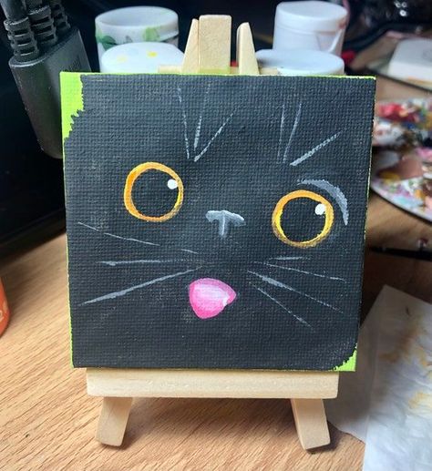 Black Cat Face With Tongue Out 3x3inch CanvasEtsy Black Cat Aesthetic Painting, Black Canvas Art Ideas Paint, Cat Drawing Canvas, Black Cat Canvas Painting Easy, Mini Canvas Cat Painting, Cute Black Cat Painting, Simple Black Cat Painting, Black Cat Painting Acrylic Easy, 2 Cats Painting