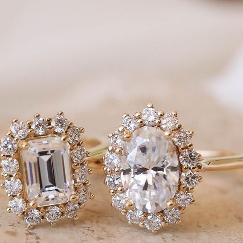 Olive Ave Jewelry on Instagram: "a halo engagement ring has a center stone with a collection of diamonds surrounding it. halo rings have a vintage charm as they became popular in the 1920s however they are popular today due to their beautiful sparkle and the illusion it creates of a larger center stone. some of our favorite halo designs are Izzy, Rachel, and Mable! are you a halo lover? 👇🏻" Unique Halo Engagement Rings, Vintage Wedding Rings 1920s, Antique Halo Engagement Rings, 1920 Wedding, Vintage Halo Ring, Unique Engagement Rings Halo, Halo Jewelry, Vintage Halo, Round Halo Engagement Rings