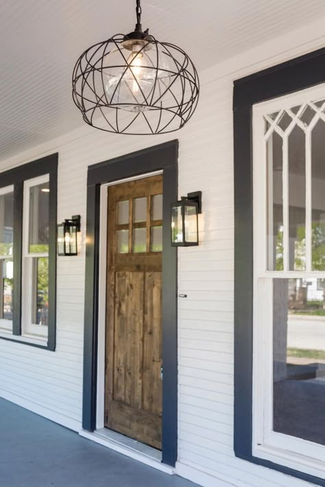 Moving A Front Door Entrance, Painted Window Trim Exterior, Black Trim Exterior Windows, Black Trimmed Windows Exterior, White Siding Black Trim Exterior Houses, White House With Black Trim Exterior, White Exterior House Black Trim, White Windows Black Trim Exterior, Black Window Trim Exterior