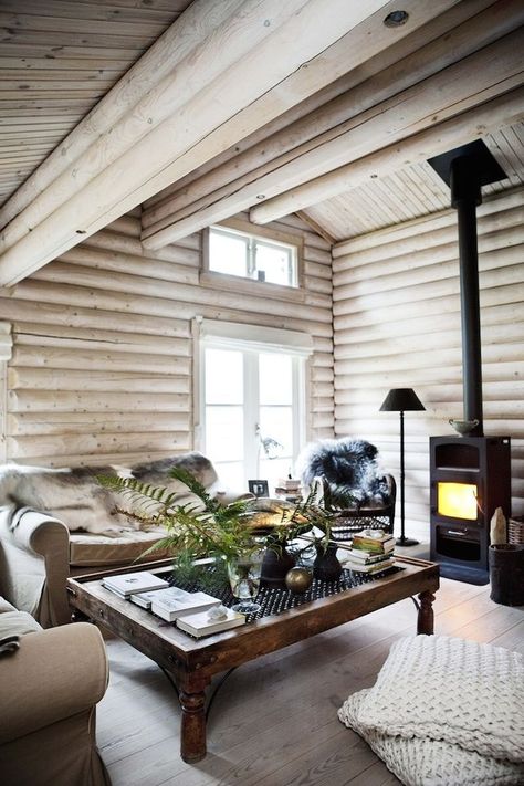 Interiors | Country Retreat | Dust Jacket | Bloglovin’ Dark Log Cabin Homes Interior, Black And White Cabin, Tiny Fireplace, Painted Log Home Interior, Norwegian Interior, Log Home Interior, White Cabin, Modern Log Cabin, Ektorp Sofa