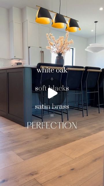 Victoria (Tori) | Home Design + Neutral Home Decor | on Instagram: "Save + follow for more kitchen inspo!
 
I LOVE this combo in my kitchen!✨
The subtle look of satin brass on the white oak and the pop of contrast against the black is just perfect.
 
Want the links for the hardware?
Comment SHOP and I’ll send to your DM. 📫
.
.
.
#homedecor #homeinspo #interiordesign #neutralhome #modernhome #neutraldecor #customkitchen #kitchendesign #kitcheninspo #whiteoakcabinets #quartzcountertops" Black Cabinets Oak Island, Light Wood Floor Black Cabinets, Black White And Oak Kitchen, White Oak Island Black Countertop, Satin Brass And Black Kitchen, Oak And Black Kitchen, White Oak Island With Soapstone, Light Floors Dark Cabinets, Contrasting Kitchen Island