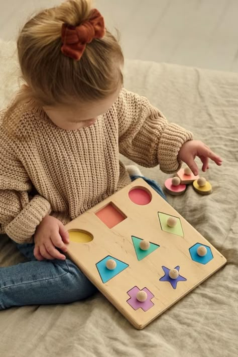 Playing with this Montessori wooden shape puzzle the child will easily learn colors and geometric shapes. The toy will also help in the development of fine motor fingers, coordination of hand movements. Wooden Shape Puzzle, Shape Puzzle, Hand Movements, Baby Puzzles, Wooden Educational Toys, Handmade Baby Toys, Natural Play, Educational Toys For Toddlers, Puzzles For Toddlers