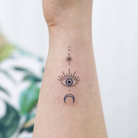 Evil eye tattoo located on the wrist, minimalistic 3rd Eye Tattoo, Ojo Tattoo, Wrist Bracelet Tattoo, Evil Eye Tattoo, Back Of Neck Tattoo, Forearm Tattoo Women, Wrist Tattoos For Women, Subtle Tattoos, Eye Tattoo