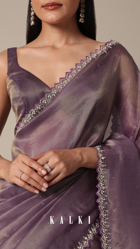 Indulge in the allure of this Orchid Glass Crush Saree. The mirror and stone embellishments on the scallop border create a rich tapestry of craftsmanship. The vibrant purple and lavender hues elevate the softness of the fabric, making it a statement piece for celebratory occasions. With detailed precision and an included unstitched blouse fabric, this saree assures a tailored fit. Saree With Mirror Work, Crush Saree, Mirror Work Border, Simple Saree Designs, New Saree Blouse Designs, Bridesmaid Saree, Lehenga Designs Simple, Purple Saree, Scallop Border