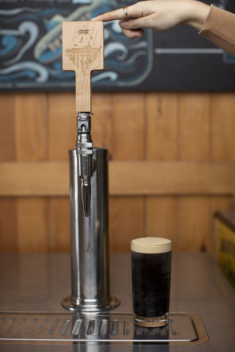 This is our Deep Steep Nitro Cold Brew. This is the tap handle we'll be putting the art onto (current art shown). Nitro Cold Brew is a variation of cold brewed coffee that uses the addition of nitrogen gas to create a smooth texture. Our nitro is 'deep steeped' meaning that we steep our cold brew coffee a little longer than others for a rich, chocolatey, smooth cold coffee. Server Station, Cold Brewed Coffee, Moon Milk, Nitro Cold Brew, Brewed Coffee, Tap Handles, Cold Coffee, Brew Coffee, Cold Brew Coffee