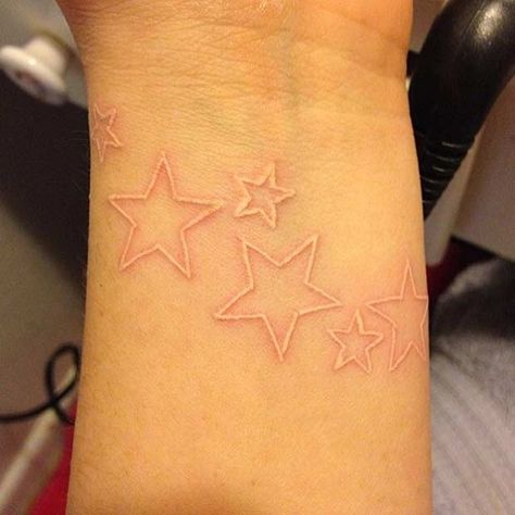 White ink stars White Simple Tattoo, White Ink Micro Tattoo, White Tattoo Ideas Female, White Ink Tattoo On Tan Skin, White Ink Star Tattoo, White Tatoos Ideas, Tattoo With White Highlights, Tattoo Ideas White Ink, White Tattoos On Black Skin