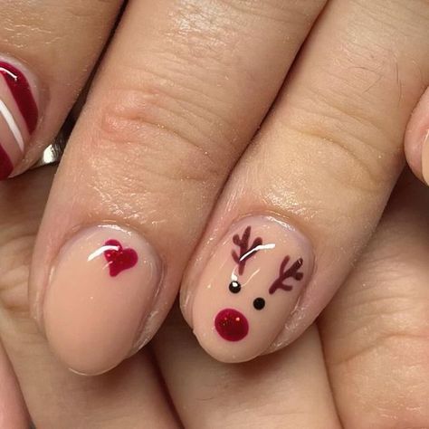 These Christmas nails are a total vibe! Think glitter, candy canes, and all the festive feels—your holiday manicure just got an upgrade! Christmas Nails With Rain Deer, Cute Short Nail Christmas Designs, Christmas Nail Designs On Short Nails, Reindeer Almond Nails, Short Reindeer Nails, Nail Design Christmas Simple, Cute Gel Christmas Nails, Cute Christmas Nails Reindeer, Reindeer On Nails