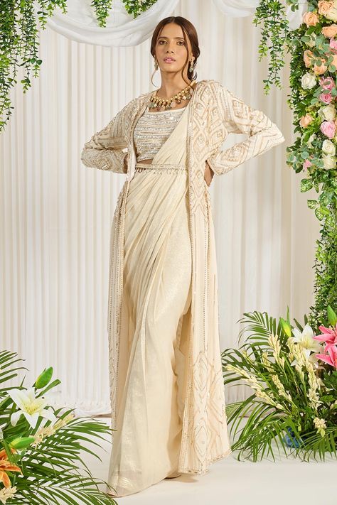 Shop for these amazing collections of Ivory Foil Georgette Embroidery Pearl Subh Bela Cape Saree Set For Women by Nidhika Shekhar online at Aza Fashions. Cinderella Fashion, Saree Jacket, Embroidery Geometric, Maggam Designs, Drape Sarees, Saree Jackets, Jacket Designs, Embroidered Cape, Fancy Sarees Party Wear