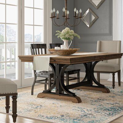 This Nailhead Extendable Dining Table brings a rustic-yet-refined charm to all your meals. The rubberwood construction will not expand and contract with varying temperatures and provides superior strength and durability. The curved sturdy base gives the table strong support and makes it a long-lasting piece. Driftwood-finished accents and nailhead trim add a rustic touch and the table comes complete with an 18" wide extension leaf which makes room for 8 people. | One Allium Way® Alena Nailhead E Extendable Dining Table Wood, Transitional Dining Room, Farmhouse Dining Room Table, Dining Table Wood, Modern Farmhouse Dining, Small Kitchens, Trestle Dining Tables, Farmhouse Dining Table, Dining Room Inspiration