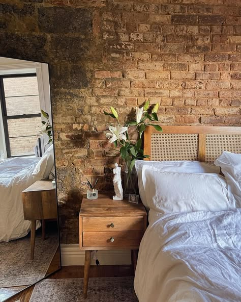 Small nyc apartment with exposed brick. White and clean decor. Brick Interior Apartment, Brick Boho Bedroom, Apartment Decorating Brick Wall, New York City Apartment Studio Brick Walls, Exposed Brick Apartment Decor, Bedroom Ideas Exposed Brick, Exposed Brick Apartment Decoration, Exposed Brick Loft Bedroom, Brick Apartment Bedroom