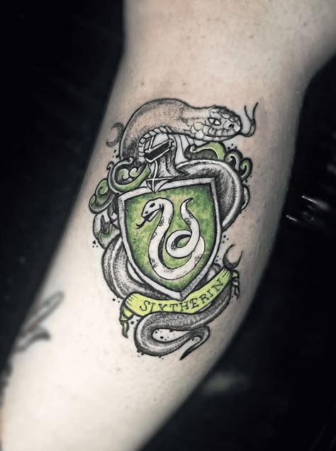 Slytherin Tattoo Design Images (Slytherin Ink Design Ideas) Slytherin Tattoo Ideas Hogwarts Houses, Slytherin Crest Tattoo, Hogwarts Legacy Tattoo, Harry Potter Slytherin Tattoo, Harry Potter Tattoos Slytherin, Slytherin Tattoo Ideas, Luna Lovegood Tattoo, Ravenclaw Tattoo, Slytherin Tattoo