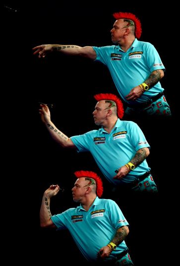 Peter Wright of Scotland in action during his third round match against Dave Chisnall of England on Day Twelve of the 2016 William Hill PDC World Darts Championships at Alexandra Palace in London Dartboard Drawing, Rocket Heater, Michael Van Gerwen, Dart Tips, Peter Wright, Play Darts, Alexandra Palace, 31 December, Dart Set