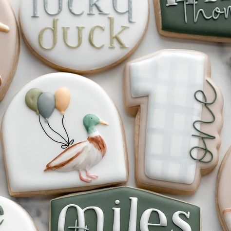 Jess Linstra on Instagram: "Miles is one lucky duck 🦆  #cookies #njcookies #cookiesofinstagram #decoratedsugarcookies #firstbirthdaycookies #oneluckyduck" One Lucky Duck Birthday Party Cookies, Mallard Duck Baby Shower Cookies, One Silly Goose Birthday Cookies, Duck Duck Deuce Birthday, Mallard Duck 1st Birthday, 1 Lucky Duck Birthday, Mallard Duck Cookies, One Silly Goose Cookies, One Lucky Duck Cookies