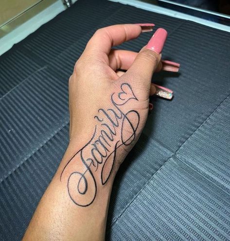 Family Hand Tattoo For Women, Hand Tattoos Names, Name Hand Tattoos For Women, Tattoos Hands Women, Side Hand Tattoos Words, Tattoo On Hands For Women, Hand Tattoos For Women Words, Name Tattoo On Buttcheek, Hand Word Tattoos