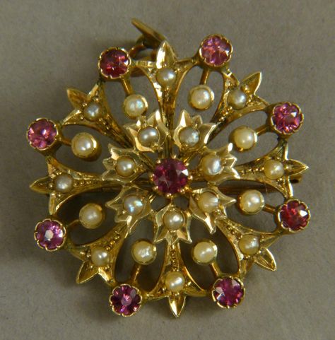 A VICTORIAN RHODALITE, GARNET AND SEED PEARL SET PENDANT/BROOCH, the circular faceted garnets and se Victorian Gold Brooches With Jewels, Victorian Jeweled Gold Brooches, Antique Pendant Brooches With Gemstone, Victorian Gold Pendant Brooches, Victorian Gold Diamond Brooches, Gold Bridal Necklace, Seed Pearl, Pearl Set, Bridal Necklace