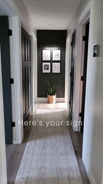 Dark Wall End Of Hallway, How To Make A Short Hallway Look Longer, Painting A Hallway, Hallway With Bedroom Doors, Black Hallway Decor, Entry Way Renovation, Painting A Hallway Ideas, Painted Hallway Doors Interior, Behind Front Door Decor Entryway