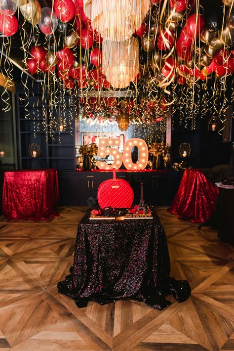 This spectacular red and gold 50th birthday party was a festive celebration filled with elegant décor and unique details. Held at 101 north eatery in Westlake Village, California, this event featured red and gold balloons, large red rose centerpieces, elegant gold platters, enormous marquee letters, and a detailed birthday cake. XO Bloom planned all of the décor and florals seen at this glamorous birthday party which created a cohesive, memorable event. Red And Black Event Decor, Red 60th Birthday Ideas, Black And Red 50th Birthday Party Ideas, Black Red And Gold Party Decorations, Roses Themed Birthday Party, Red And Gold Birthday Party Decoration, 50th Birthday Party Ideas For Woman, Black And Red Decor Party Ideas, Red Black And Gold Birthday Party Decor