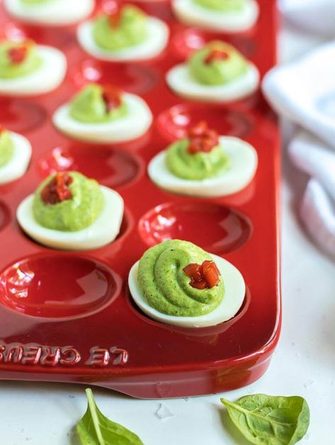 green and red deviled eggs in red serving platter Green Deviled Eggs, Christmas Deviled Eggs, Holiday Deviled Eggs, Healthy Deviled Eggs, Deviled Egg Recipe, Devilled Eggs Recipe Best, Deviled Eggs Recipe Classic, Healthy Appetizers Easy, Christmas Appetizers Easy