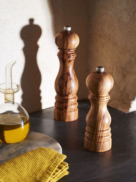 This olive wood version of Peugeot's Paris mill features a contrasting, yet authentic design. The irregular natural grain coursing through this noble wood gives this 18 cm/ 7 in manual salt and pepper mill a highly distinctive feel. Helix Shape, Countertop Accessories, Bakeware Storage, Wood Mill, Kitchen Utensil Organization, Waterproof Picnic Blanket, Spice Mill, Salt Mill, Salt And Pepper Mills