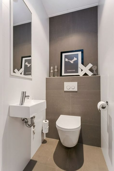 a neutral guest toilet done in taupe and white, an artwork, a wall mounted sink and a large mirror Minimalist Powder Room, Small Toilet Design, Guest Wc, Small Downstairs Toilet, Toilette Design, Toilet Ideas, Toilet Room Decor, Wc Design, Small Toilet Room