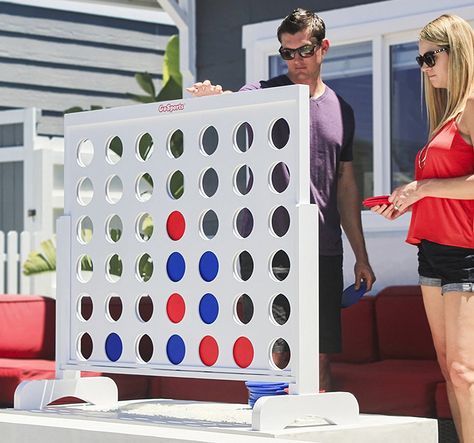 A massive 4 feet wide and 3.5 feet tall wooden version of the classic 4-in-a-row game we know and love. Giant Board Games, Giant Connect Four, Fun Backyard, Coin Games, 4 In A Row, Connect Four, Giant Games, Backyard Pools, Yard Games