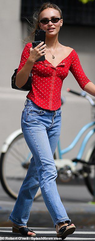 On a call: The actress took a phone call while wearing a low-cut red blouse, blue jeans an... Lily Rose Depp Street Style, Lily Rose Depp Outfits, Lily Rose Depp Style, Brittany Murphy, Emma Chamberlain, Jane Birkin, Lily Rose Depp, Lily Rose, Kate Moss