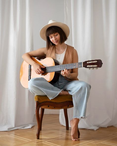 Sitting Down Playing Guitar Reference, Person With A Guitar Reference, Play Guitar Reference, Person Sitting Playing Guitar, Guitar Pose Reference Sitting, Sitting Guitar Pose, Women With Guitars, Pose Reference Photo Guitar, Playing Guitar Pose Reference Sitting