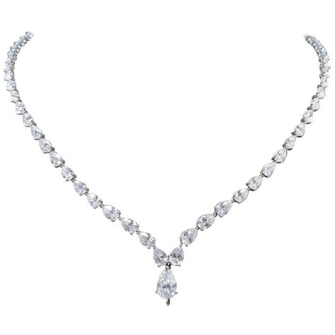 Scarselli is featuring a Platinum 22.22 carat Pear Cut Diamond Tennis Necklace. Total of 68 diamonds color graded D-E-F, and clarity VVS-SI encountered into a front drop pear cut diamond 1.08ct GIA certificate 5146770762 (see certificate picture for detailed stone information). The inside length of the necklace is 16" and can be worn without or with any additional pendant acquisition, using the hidden hook that securely grabs any sized pendant like this breathtaking Scarselli 8 carat Fancy Vivid Diamond Teardrop Necklace, Pear Shaped Necklace, Money And Jewelry, Vintage Diamond Necklace, Accessories For Beach, Pink Purple Wedding, Diamond Necklace Wedding, Drop Necklaces, Diamond Drop Necklace