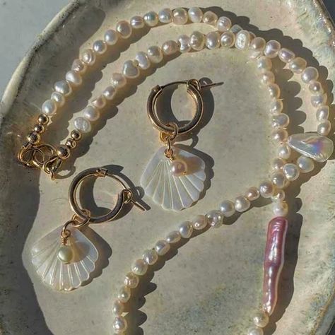 ✨🐚Seashells scattered along the shore, each a memory of the tide, mother of pearl glimmers softly, reflecting whispers of the sea, a treasure of quiet beauty 🌊✨ Spotlight on the Lola Mother of Pearl Hoops. These flirty hoops shimmer in the sun's rays and flutter in a beautiful motion. Available in Ocean-safe, Shower-safe 14k gold filled premium metal or Sterling silver. Both perfect for sensitive skin. From the Ocean Opulence Collection Explore @angelawozniakjewellery . . . #goldhoopea... Coastal Grandmother Aesthetic Jewelry, Coastal Grandmother Aesthetic, Grandmother Aesthetic, Quiet Beauty, Coastal Grandmother, Aesthetic Jewelry, Sun Rays, The Ocean, Mother Of Pearl