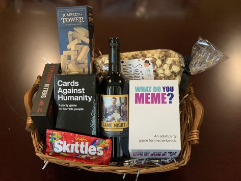 Great gift idea! Recreate this gift basket by visiting our website to find the store nearest you that carries #GameNightWine #merlot #themenightwines #cardsagainsthumanity #whatdoyoumeme #jenga #giftbasketideas #giftideas #housewarminggifts #giftideas #giftsforteachers #teachergiftideas #winebaskets #winegifts Jack And Jill Gift Basket Ideas, Tailgating Gift Basket Ideas, Prize Baskets For Adults, Cricut Gift Basket, Prize Basket Ideas For Adults, Family Game Night Basket Ideas, Raffle Prize Ideas For Adults, Game Night Basket Ideas, Gift Basket Ideas Men