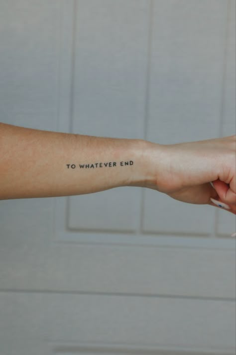 Woman shows off her small wrist tattoo that says “To Whatever End” Tell Me Tomorrow Tattoo, Curse Breaker Tattoo, First Tattoo Aesthetic, You Do Not Yield Tattoo, To Whatever End Tattoo, Book Quotes Tattoo, Book Inspired Tattoos, End Tattoo, Word Tattoos With Meaning