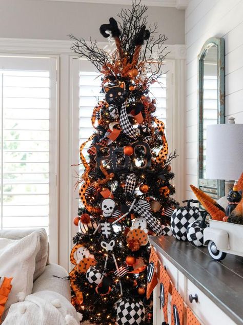 13 Halloween Tree Decorating Ideas | HGTV Fall Christmas Tree, Halloween Tree Decorations, Halloween Decorations Apartment, Seasonal Tree, Halloween Christmas Tree, Pencil Tree, Casa Halloween, Halloween Decor Diy, Holiday Trees