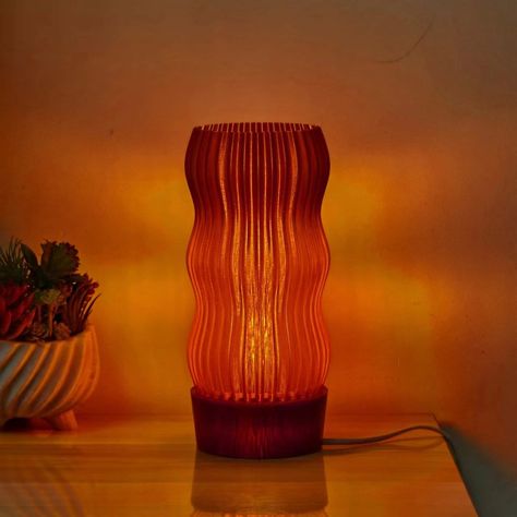 Looking for a unique and eco-friendly lighting solution for your home? Look no further than our Wave Table Lamp! Crafted from locally sourced and recycled plastic, this lamp is both sustainable and stylish. Its captivating wavy design is inspired by Art Deco aesthetics, adding a touch of retro charm to any space. Measuring at 255x115x115mm (12.6x4.7x4.7in) and with a cable length of 1 meter (3.3 Feet), the Wave Lamp is suitable for use with LED bulbs only, with our advised bulb being a 12W A15 L Scandinavian Interior Lamp, Vibey Lamp, Cozy Table Lamp, Warm Table Lamp, Bedside Lamp Aesthetic, Cozy Lighting Bedroom, Cool Lamps Bedrooms, Ambient Lighting Bedroom, Ambient Lighting Living Room