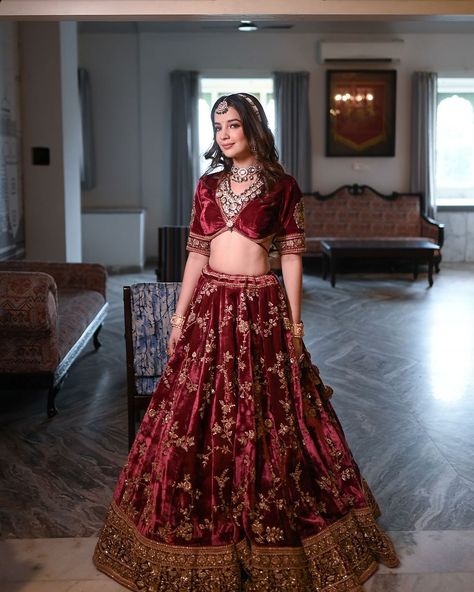 Feel elegant in our Maroon Velvet Lehenga, beautifully embroidered with Aari Tari designs. ✨  Perfect for special occasions, its rich velvet fabric and intricate details add sophistication. ❤️  Step into timeless beauty and make a statement effortlessly with this stunning outfit.  Talent : @vaishnavi_sharma_19 Makeup : @makeup_paayal . . . #aaritari #outfits #red #velvet #wedding #outfits #women #style #weddingoutfits #lehengas #womenfashion #lehengasinspiration Velvet Red Lehenga, Burgundy Lengha, Velvet Lehenga Blouse, Maroon Wedding Lehenga, Velvet Lehenga Designs, Bridal Lehenga Red Royal, Wedding Outfits Women, Red Velvet Lehenga, Bridal Reception Lehenga