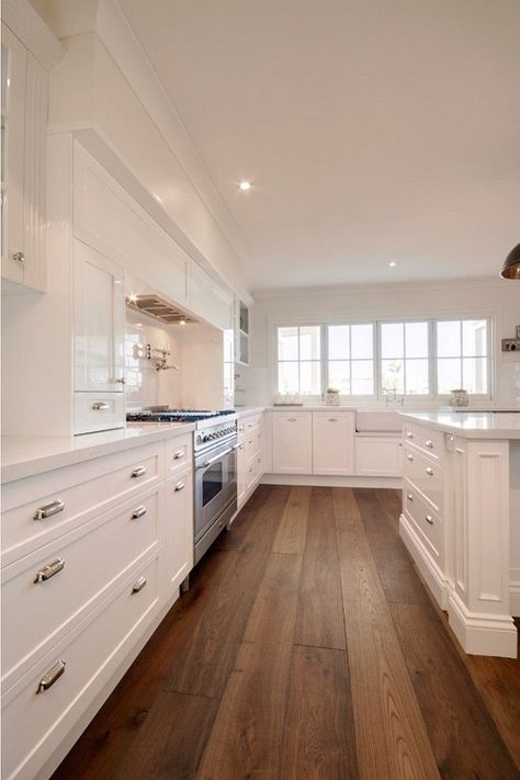 Clean white kitchen design with wood floor Luxury White Kitchen Design, Luxury White Kitchen, Hardwood Plank Flooring, Timeless Kitchen Design, Wood Floor Kitchen, Hardwood Floors Dark, Wood Floors Wide Plank, Timeless Kitchen, Wood Laminate Flooring