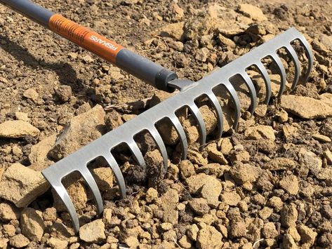 No matter how big or small your yard is, garden rakes are a category of essential landscaping tools. Learn if this rake is the right rake for your DIY project. Rake Head Ideas, Metal Rake Head Ideas, Cleaning Garden Tools Remove Rust, Landscape Rake, Raking Leaves, Rubber Mulch, Digging Tools, Landscaping Tools, Garden Rake