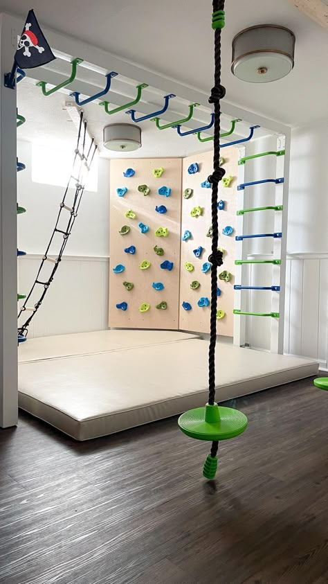 Inside Of House Ideas, Basement Rock Wall, Diy Sensory Gym At Home, Indoor Kids Gym Playroom, Diy Indoor Rock Wall For Kids, Basement Ninja Course, Kids Rock Climbing Wall Indoor, Fun Garage Ideas, Rock Wall Basement