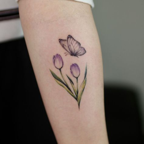 Tulips And Butterfly Tattoo, Butterfly With Tulips Tattoo, Tulip Tattoo Women, Purple Tulips Tattoo, Tulip With Butterfly Tattoo, Tulip Butterfly Tattoo, Tulip And Butterfly Tattoo, Dainty Tulip Tattoo, Tulip Tattoo Design