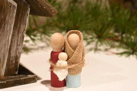 During this time of year, many display nativity scenes in celebration of Jesus' birth. These miniature nativity figures of Joseph, Mary, and baby Jesus are not only fun to make and play with, but they are a great visual reminder of the reason we celebrate!     What You'll Need  Two 3" peg people and one 1" peg person ( Simple Peg Doll Nativity, Wooden Mary Joseph And Baby Jesus, Wood Peg Nativity, Nativities To Make, Nativity Figures Diy, Peg Nativity Set, Diy Manger Nativity, Diy Wooden Nativity, Joseph Crafts