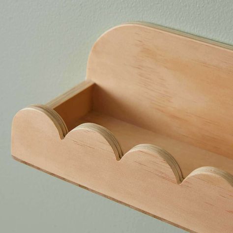 Add a playful shelf to any wall with the Sarah Scalloped Wall Shelf. Featuring a wavy, scalloped design underneath a sturdy flat shelf, this floating shelf adds fun pattern and shape to any space. Crafted in a natural plywood, it has an organic feel and instils any home with warm, wood tones. Perfect for a kid's bedroom, nursery or even a playful home office or living space, you'll love the interest this shelf adds to a room. As much as it is decorative, this wall shelf is also functional, offer Curvy Shelf, Scalloped Shelves, Ikea Lack Wall Shelf, Nursery Design Ideas, Scalloped Shelf, Kids Shelf, Kids Room Shelves, Playful Home, Boat Interior Design