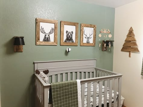 Cutest baby boy woodland nursery. Grey and tan with green and wood accents. Sage Green Nursery With Grey Crib, Grey Tan Green Nursery, Green Accent Wall With Grey Crib, Green Nursery With Grey Crib, Green Nursery Gray Crib, Nursery Woods Theme, Green Gray Brown Nursery, Grey And Sage Green Nursery, Green And Grey Nursery Ideas