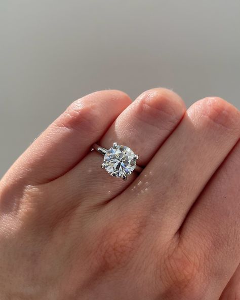 Round Engagement Ring💍 This classic shape makes for a sparkly diamond that truly outshines all others. If you want something elegant and classy, but also blindingly brilliant, you cannot go wrong with a Round Brilliant Cut✨ Start customizing your dream ring💍link in bio . . . wedding rings, custom jewelry, jewelry trends, ring inspo, ring inspiration #ringinspiration #ringinspo #jewelrydesign #weddingrings #rounddiamonds #roundengagementring Solitaire Engagement Ring Cushion Cut, Platinum Round Engagement Rings, Engagement Rings Small Hands, 3 Carat Round Engagement Ring, Engangement Rings, 2ct Round Engagement Ring, Circle Engagement Rings, Round Engagement Ring White Gold, Small Engagement Rings