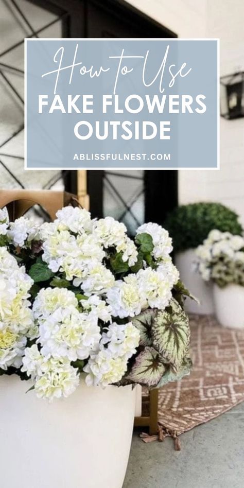 Transform your outdoor spaces with the magic of faux flowers. Learn how to use fake flowers outside to create stunning arrangements that withstand the elements. With a little creativity, you can craft beautiful displays that add a touch of elegance to your patio, balcony, or garden. Say goodbye to wilting blooms and hello to year-round beauty! #artificialplants #outdoorliving #easygardening Fake Plants Porch, Fake Flowers For Outside Pots, Faux Plants Around Pool, Faux Outdoor Plants Porches, Faux Outdoor Flowers, Fake Outdoor Plants Landscaping, Outdoor Fake Flower Pot Ideas, Fake Flowers Outdoors, Faux Flowers Outdoors